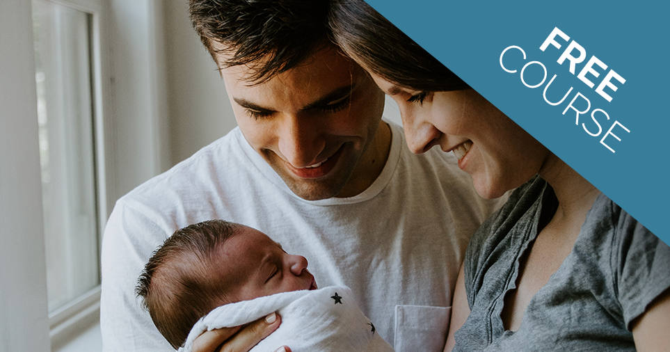 married couple holding child