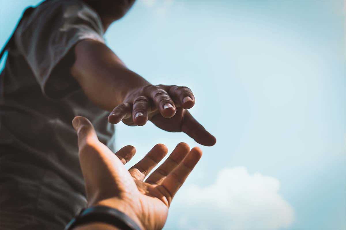 Person reaching for a hand