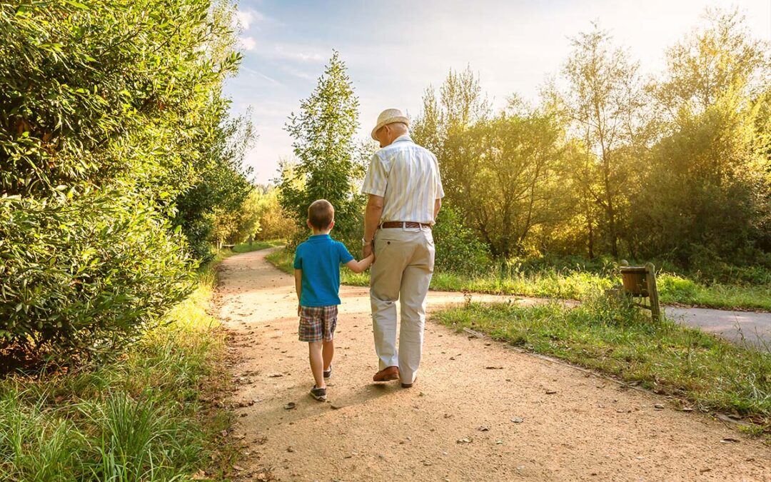 Grandfather guiding his grandchild